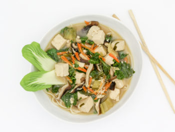 Asian soup pictured from above with chopsticks